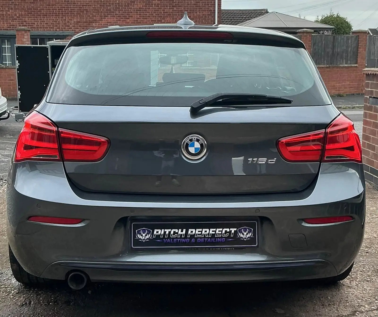 Rear of a grey BMW 116d fitted with a Pitch Perfect number plate
